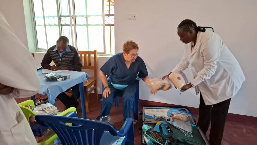 Dr. Teressa sharing donated medical supplies with the local health care team