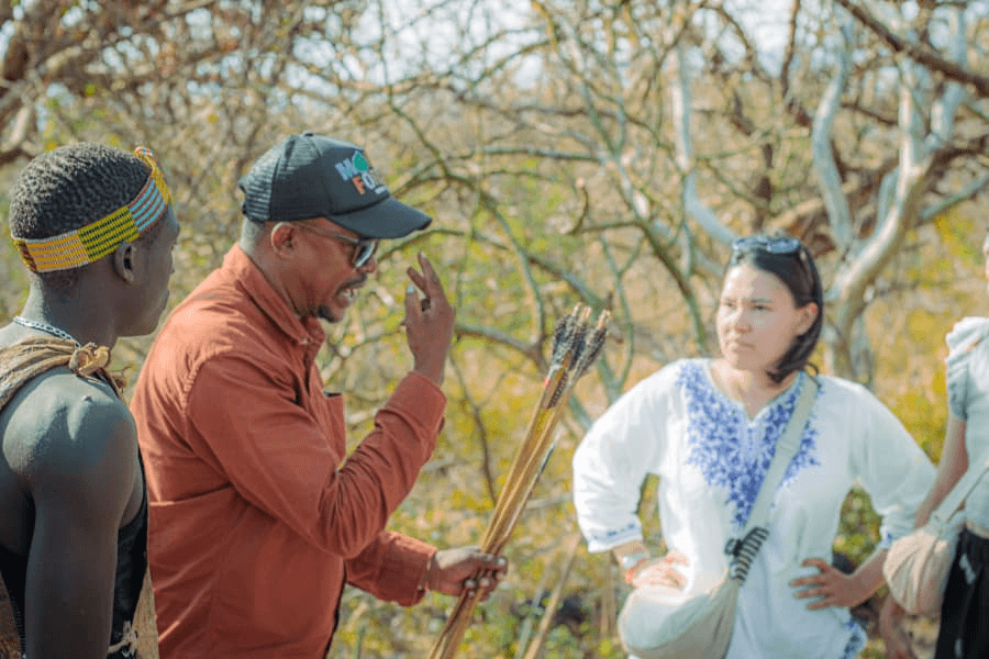 A local guide welcoming guests during a Lake Eyasi cultural visit